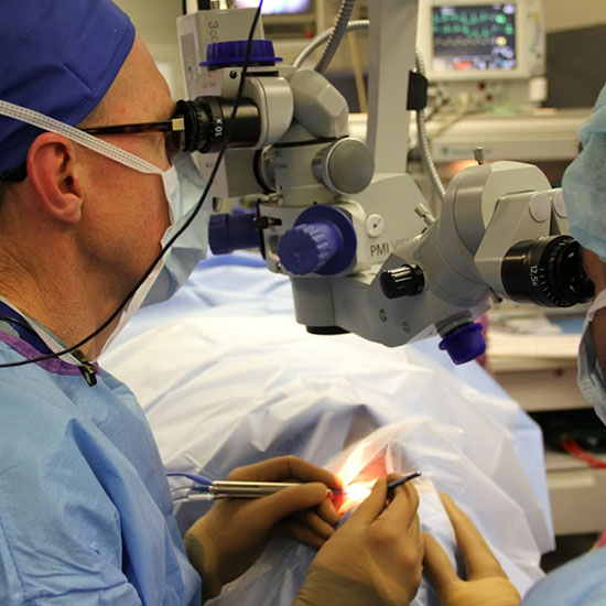 Dr. Simon Holland performing eye surgery